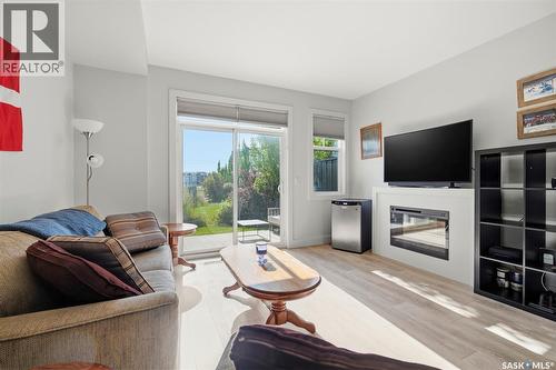 618 701 Meadows Boulevard, Saskatoon, SK - Indoor Photo Showing Living Room With Fireplace