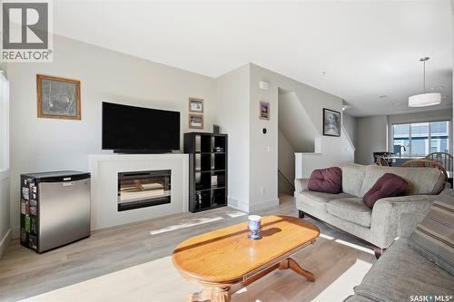 618 701 Meadows Boulevard, Saskatoon, SK - Indoor Photo Showing Living Room With Fireplace
