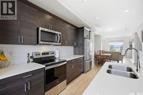 618 701 Meadows Boulevard, Saskatoon, SK - Indoor Photo Showing Kitchen With Double Sink With Upgraded Kitchen