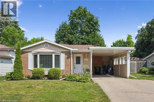 Charming brick ranch home featuring a covered front entry, picture window with substantial glazing, and an attached carport - 659 Glen Forrest Boulevard, Waterloo, ON - Outdoor