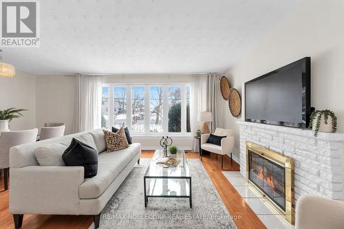 4230 Bloor Street W, Toronto, ON - Indoor Photo Showing Living Room With Fireplace
