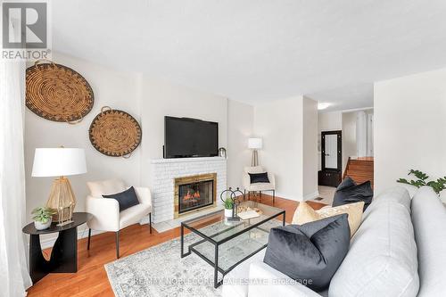 4230 Bloor Street W, Toronto, ON - Indoor Photo Showing Living Room With Fireplace