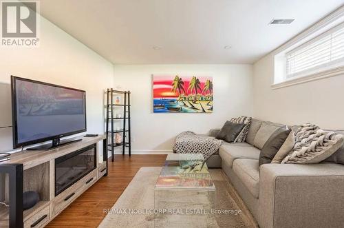 4230 Bloor Street W, Toronto, ON - Indoor Photo Showing Living Room With Fireplace
