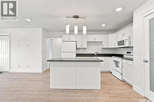 501 110 Akhtar Bend, Saskatoon, SK - Indoor Photo Showing Kitchen With Double Sink
