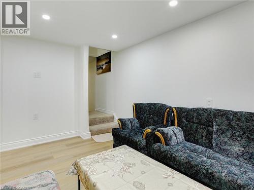 Recessed lighting, light-toned walls, wood-finish flooring, and carpeted stairs - 128 Macatee Place, Cambridge, ON - Indoor
