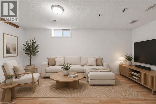 Virtually staged rec room - 449 Exmoor Street, Waterloo, ON - Indoor Photo Showing Living Room