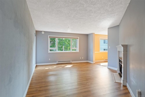 #302-9975 Fifth St, Sidney, BC - Indoor With Fireplace