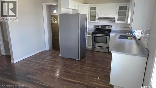 215 Central Street W, Warman, SK - Indoor Photo Showing Kitchen With Double Sink