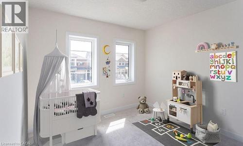 Neutral wall color, two windows, wall-to-wall carpeting, overhead lighting, white trim - 16 Monteith Drive, Brantford, ON - Indoor