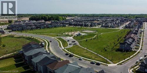 Well-defined residential neighborhood featuring a central green space, paved pathways, and multiple street networks - 16 Monteith Drive, Brantford, ON - Outdoor With View