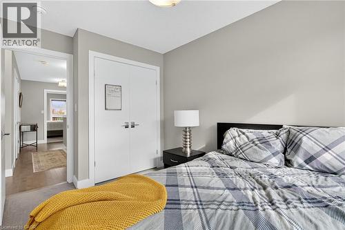 Recessed lighting, wood-finish flooring, and a built-in closet with double doors - 60 Arkell Road Unit# 57, Guelph, ON - Indoor Photo Showing Bedroom