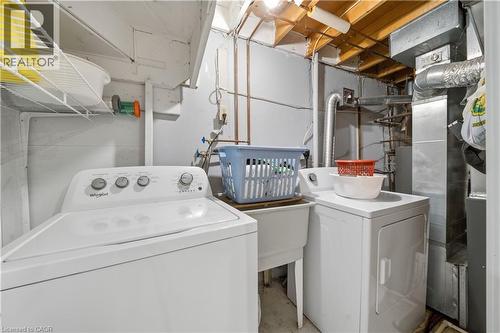 Dedicated laundry area featuring a utility sink and white appliances - 230 Sunset Boulevard, Cambridge, ON - Indoor Photo Showing Laundry Room