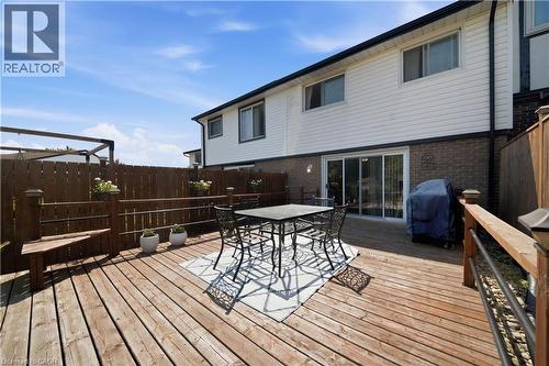 Expansive wood deck with a built-in bench, offering direct access to the interior through sliding glass doors - 230 Sunset Boulevard, Cambridge, ON - Outdoor With Deck Patio Veranda With Exterior