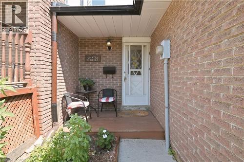 Brick exterior with covered front entry and a wood-finish porch - 230 Sunset Boulevard, Cambridge, ON - Outdoor
