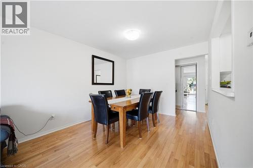 Bright interior space featuring wood-finish flooring, white walls, and a recessed ceiling light - 230 Sunset Boulevard, Cambridge, ON - Indoor Photo Showing Dining Room