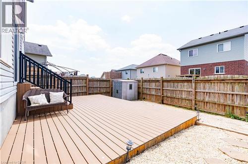 Expansive outdoor deck with a dark railing and integrated steps - 122 Iron Gate Street, Kitchener, ON - Outdoor With Deck Patio Veranda With Exterior