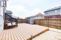 Expansive outdoor deck with a dark railing and integrated steps - 