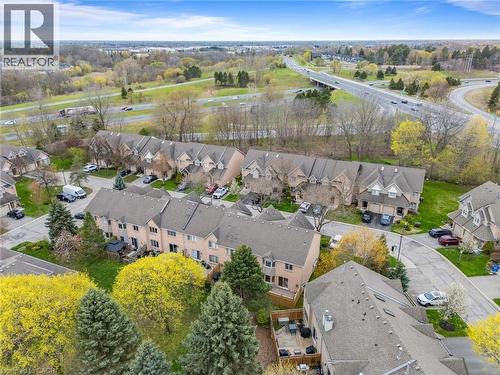 Townhome community with private backyard spaces, individual garages, and mature landscaping - 320 Hamilton Drive Unit# 10, Ancaster, ON - Outdoor With View