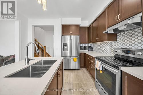19 Findlay Way, Centre Wellington, ON - Indoor Photo Showing Kitchen With Double Sink With Upgraded Kitchen