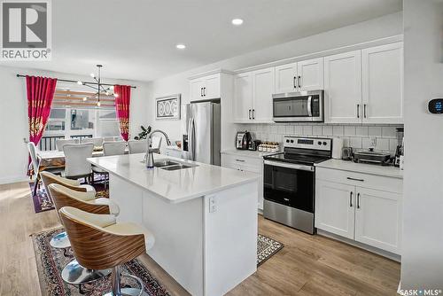 138 Rosewood Boulevard E, Saskatoon, SK - Indoor Photo Showing Kitchen With Double Sink With Upgraded Kitchen
