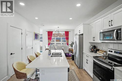 138 Rosewood Boulevard E, Saskatoon, SK - Indoor Photo Showing Kitchen With Double Sink With Upgraded Kitchen
