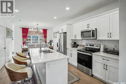 138 Rosewood Boulevard E, Saskatoon, SK - Indoor Photo Showing Kitchen With Double Sink