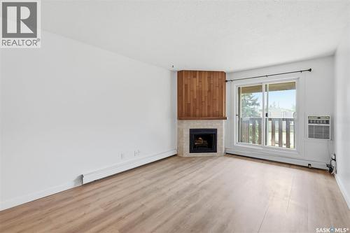 1233 425 115Th Street E, Saskatoon, SK - Indoor Photo Showing Living Room With Fireplace