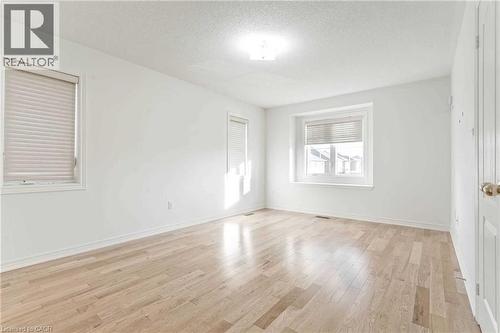 Empty room featuring light wood finished floors and a textured ceiling - 3 Coolwater Drive Unit# Upper, Brampton, ON - Indoor Photo Showing Other Room