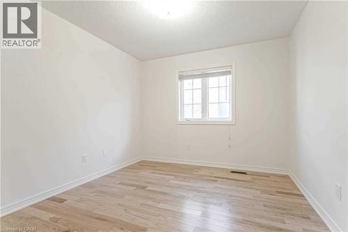 Unfurnished room featuring light wood finished floors and a textured ceiling - 3 Coolwater Drive Unit# Upper, Brampton, ON - Indoor Photo Showing Other Room