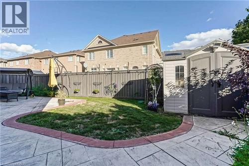 View of yard featuring a shed, a patio area, and a residential view - 3 Coolwater Drive Unit# Upper, Brampton, ON - Outdoor With Deck Patio Veranda