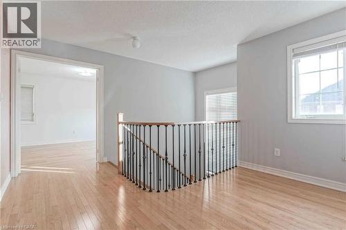 Hallway featuring an upstairs landing, wood finished floors, and a textured ceiling - 3 Coolwater Drive Unit# Upper, Brampton, ON - Indoor Photo Showing Other Room