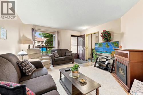 386 Cedar Meadow Drive, Regina, SK - Indoor Photo Showing Living Room With Fireplace