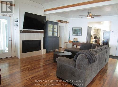 Open Concept Living Room and Dining Room - 6576 Quarry Point Road, Ramara, ON - Indoor Photo Showing Living Room With Fireplace