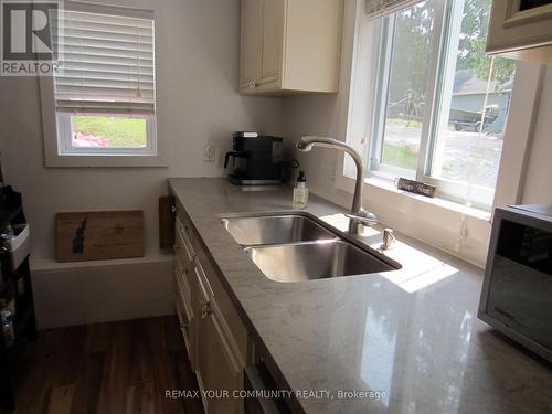 Kitchen/door to Recycle&Garbage Bins - 6576 Quarry Point Road, Ramara, ON - Indoor Photo Showing Kitchen With Double Sink