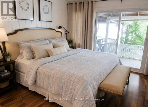 Primary Bedroom /Walkout to Covered Porch and view - 6576 Quarry Point Road, Ramara, ON - Indoor Photo Showing Bedroom