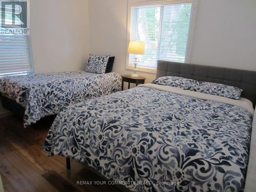 Bedroom#3  with Queen and Twin Beds - 6576 Quarry Point Road, Ramara, ON - Indoor Photo Showing Bedroom