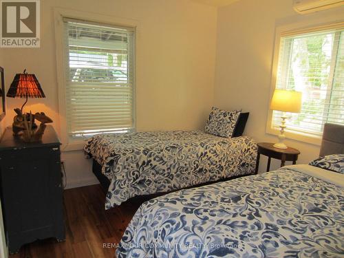 Bedroom #3 with 2 windows - 6576 Quarry Point Road, Ramara, ON - Indoor Photo Showing Bedroom