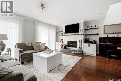 1142 Gryphons Walk, Regina, SK - Indoor Photo Showing Living Room With Fireplace