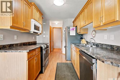 225 Mikkelson Drive, Regina, SK - Indoor Photo Showing Kitchen With Double Sink