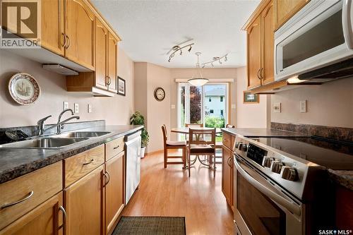 225 Mikkelson Drive, Regina, SK - Indoor Photo Showing Kitchen With Double Sink
