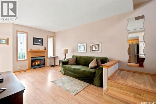 225 Mikkelson Drive, Regina, SK - Indoor Photo Showing Living Room With Fireplace