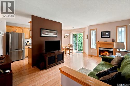 225 Mikkelson Drive, Regina, SK - Indoor Photo Showing Living Room With Fireplace
