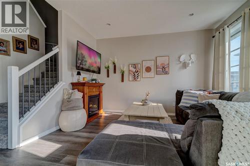 137 3229 Elgaard Drive, Regina, SK - Indoor Photo Showing Living Room With Fireplace