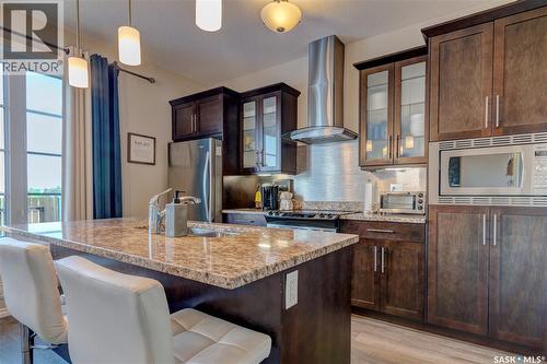 137 3229 Elgaard Drive, Regina, SK - Indoor Photo Showing Kitchen With Upgraded Kitchen