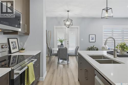 143 Sharma Lane, Saskatoon, SK - Indoor Photo Showing Kitchen With Stainless Steel Kitchen With Double Sink With Upgraded Kitchen
