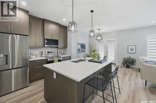 143 Sharma Lane, Saskatoon, SK - Indoor Photo Showing Kitchen With Stainless Steel Kitchen With Double Sink With Upgraded Kitchen