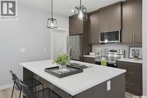 143 Sharma Lane, Saskatoon, SK - Indoor Photo Showing Kitchen With Double Sink With Upgraded Kitchen
