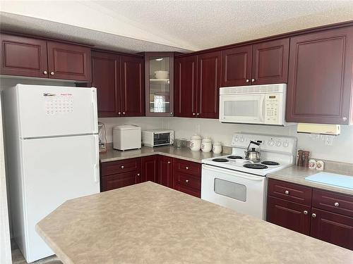 68 Bluebird Crescent, Brandon, MB - Indoor Photo Showing Kitchen