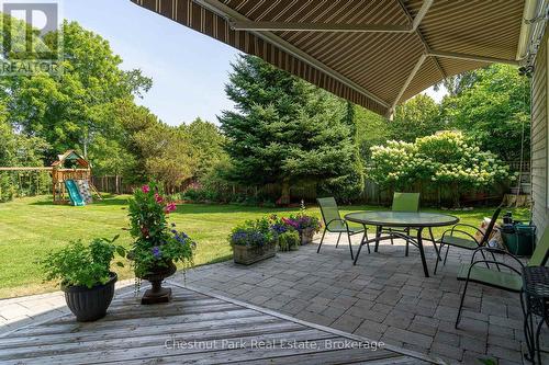 Private backyard surrounded by mature trees - 71 Hickory Street, Collingwood, ON - Outdoor With Deck Patio Veranda