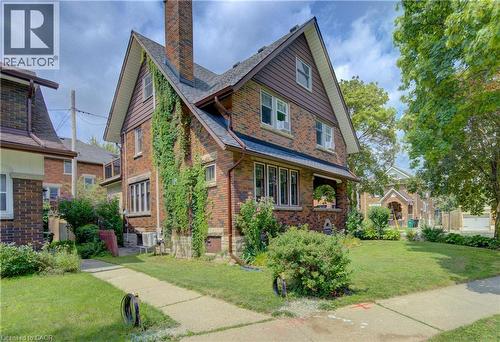 Brick exterior with gabled roofline, and front yard with mature landscaping - 150 Union Boulevard, Kitchener, ON - Outdoor